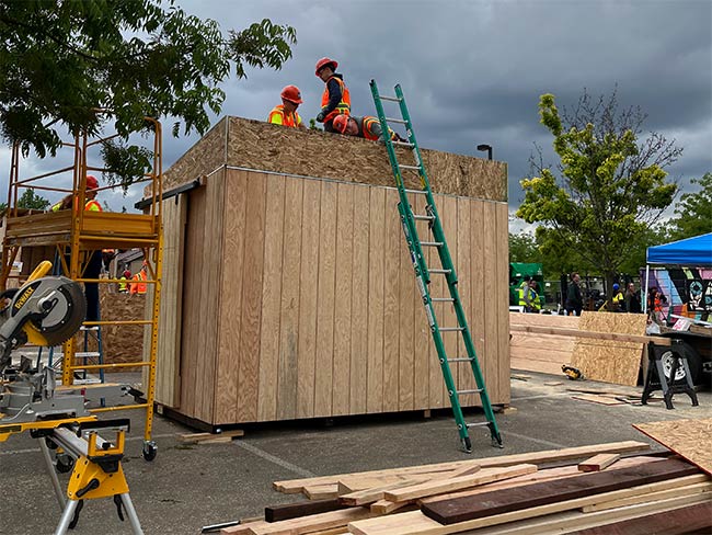 students constructing a shed